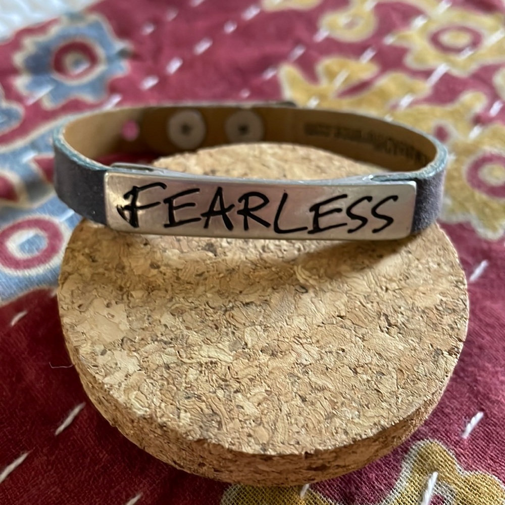 Navy leather cuff with metal FEARLESS accent